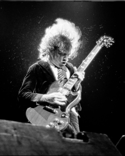 Angus Young photographed on stage in 1986.